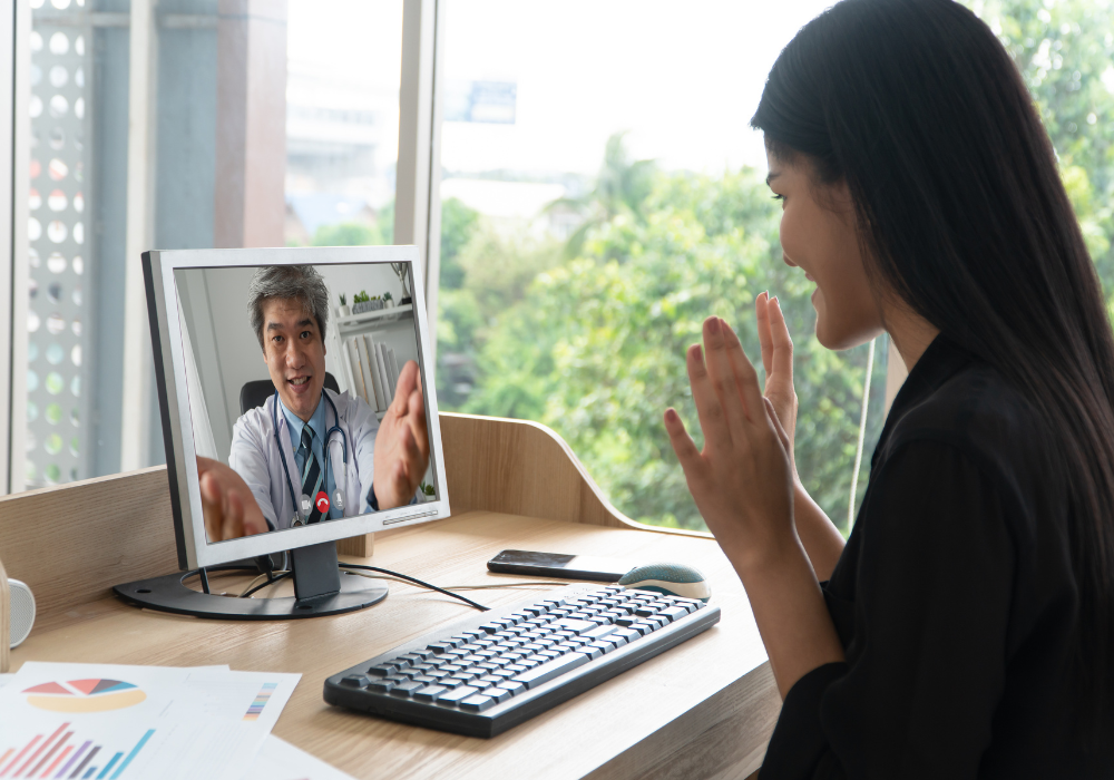 a woman having a virtual appointment with a pjhysician