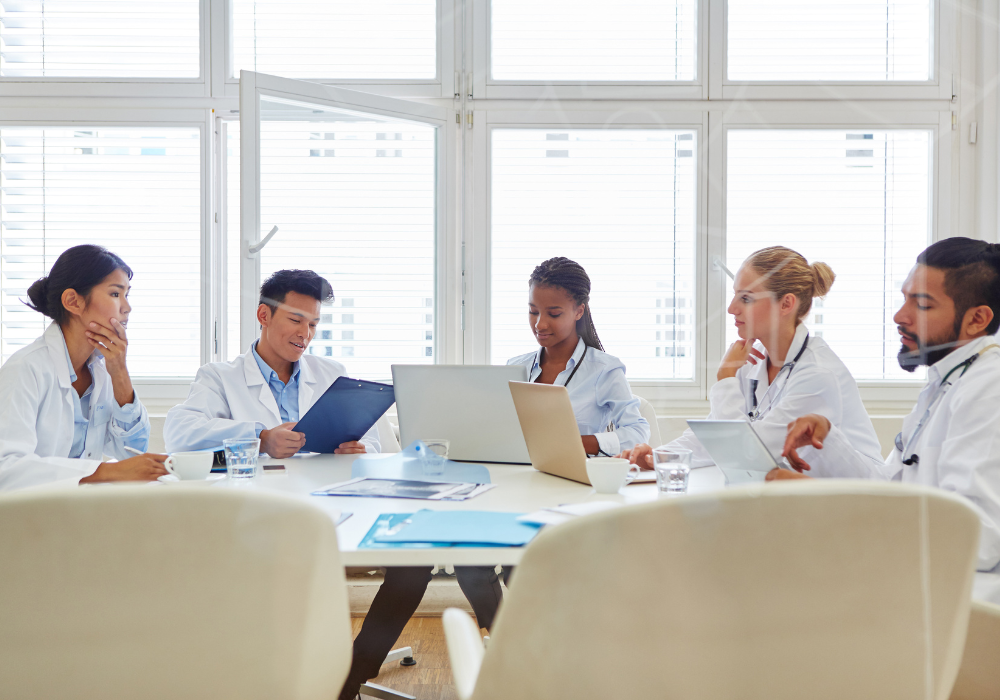 a group of healthcare professionals collaborating in a conference room