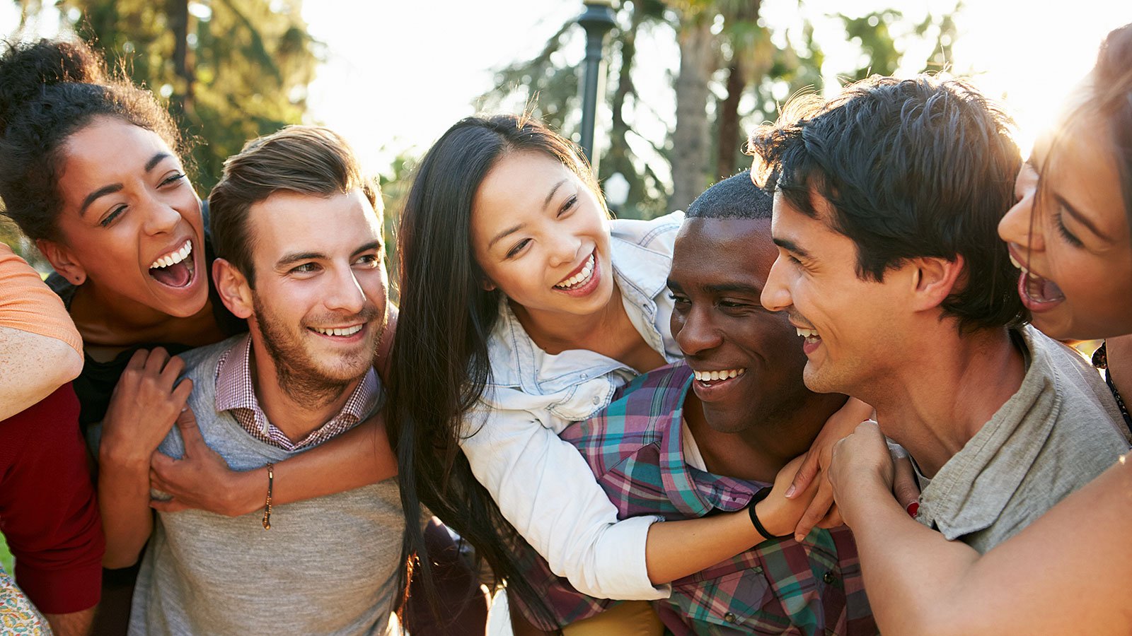 a group of friends laughing and hugging