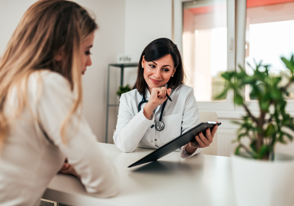 female doctor speaking with female patient