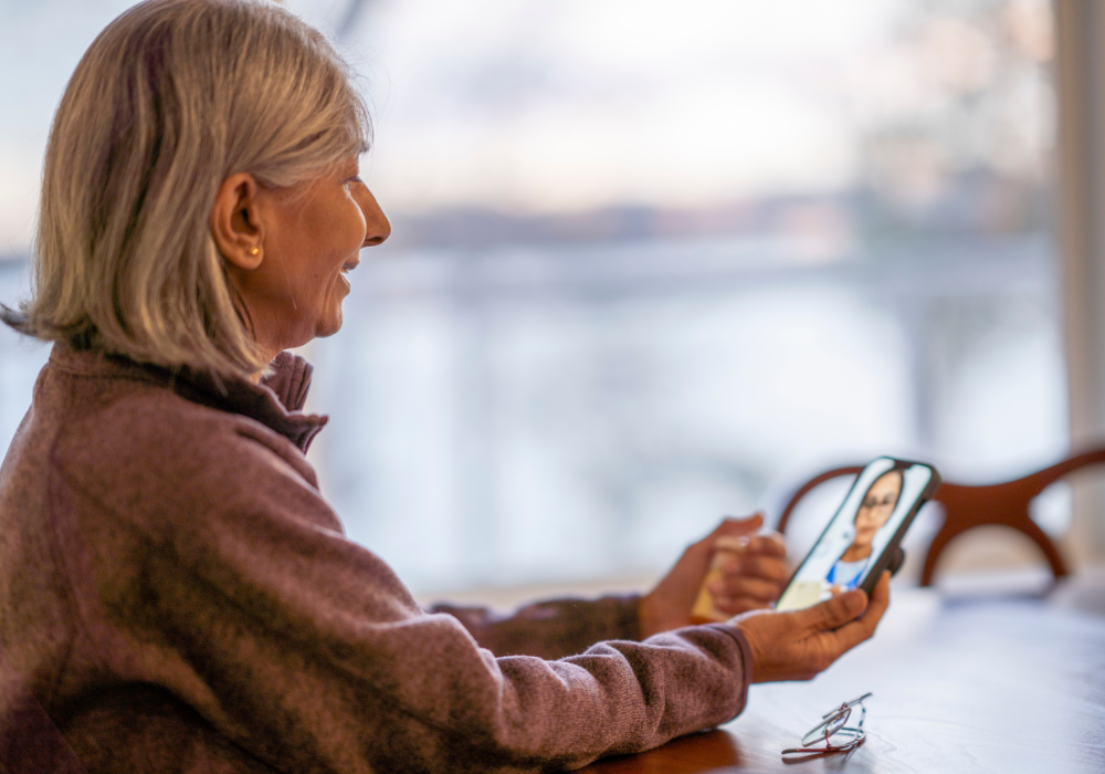 elderly woman doing a virtual visit with a doctor