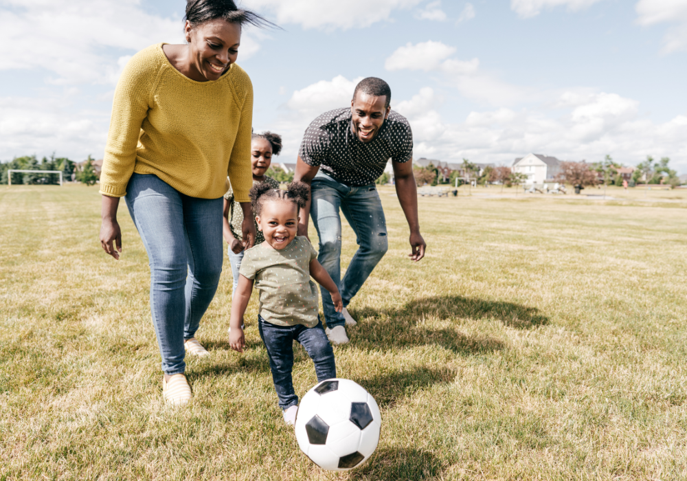 family playing soccer