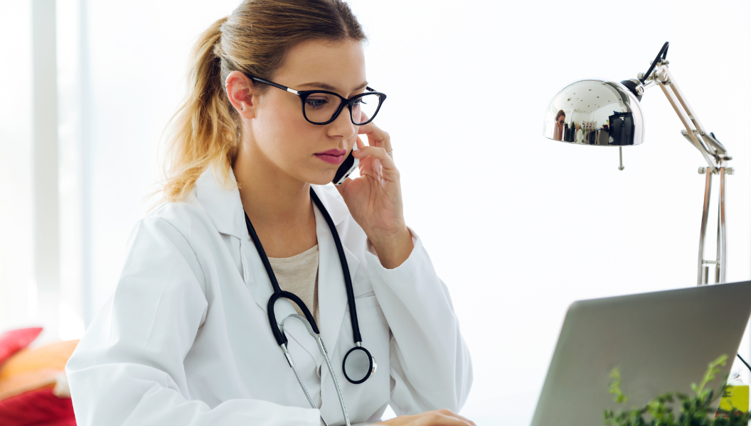 female doctor on the phone