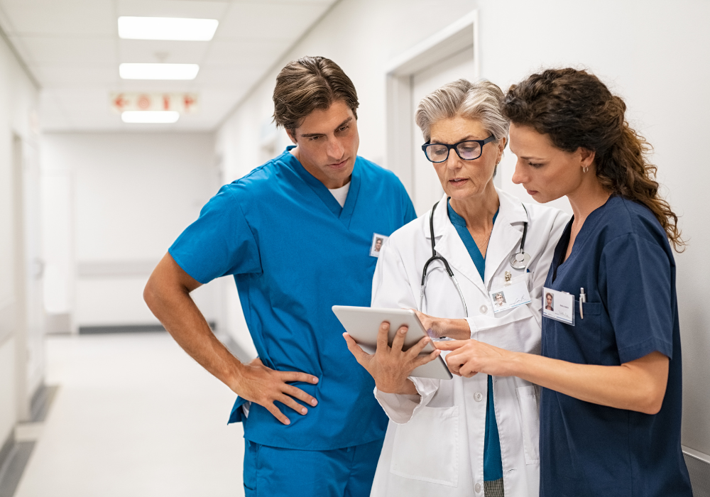 a group of doctors discussing notes