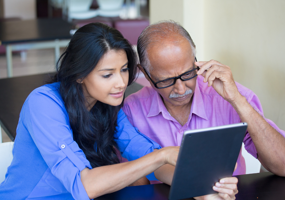 indian woman and man on a tablet