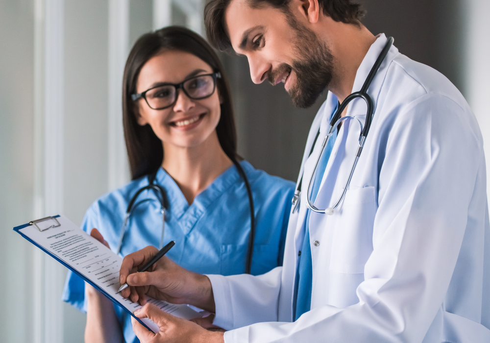 male doctor smiling with female nurse