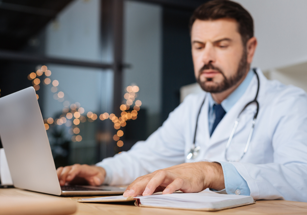 white male doctor with notebook